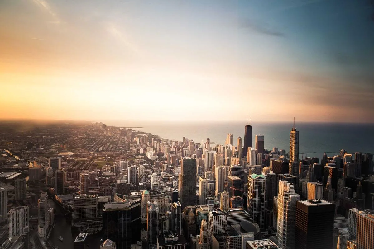 A city skyline at sunset seen from above